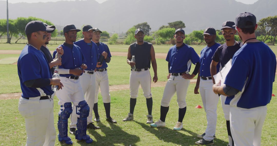 Baseball team having a discussion during practice on field - Free Images, Stock Photos and Pictures on Pikwizard.com