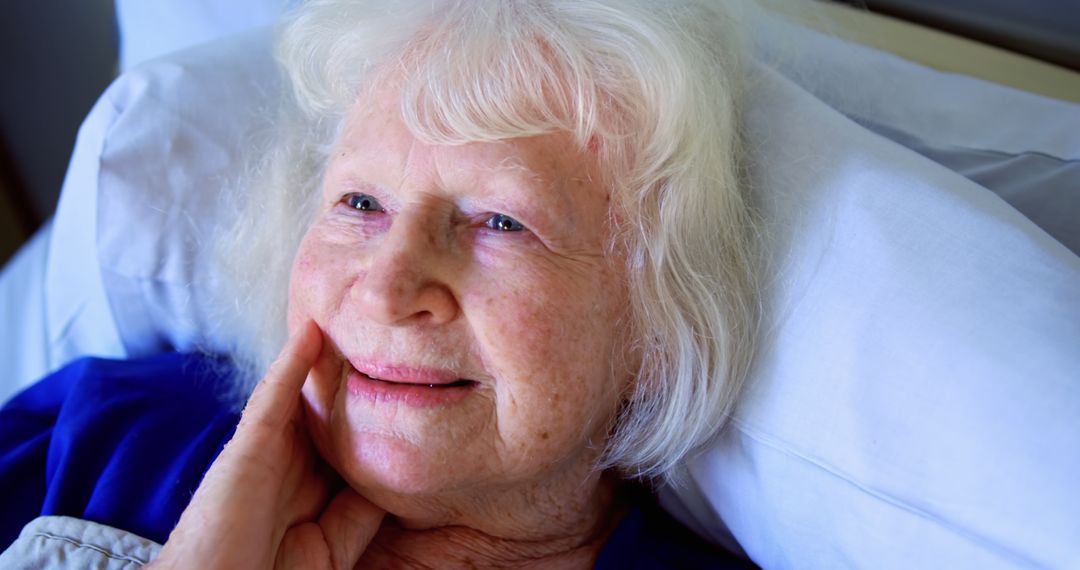 Happy Elderly Woman Lying in Hospital Bed - Free Images, Stock Photos and Pictures on Pikwizard.com