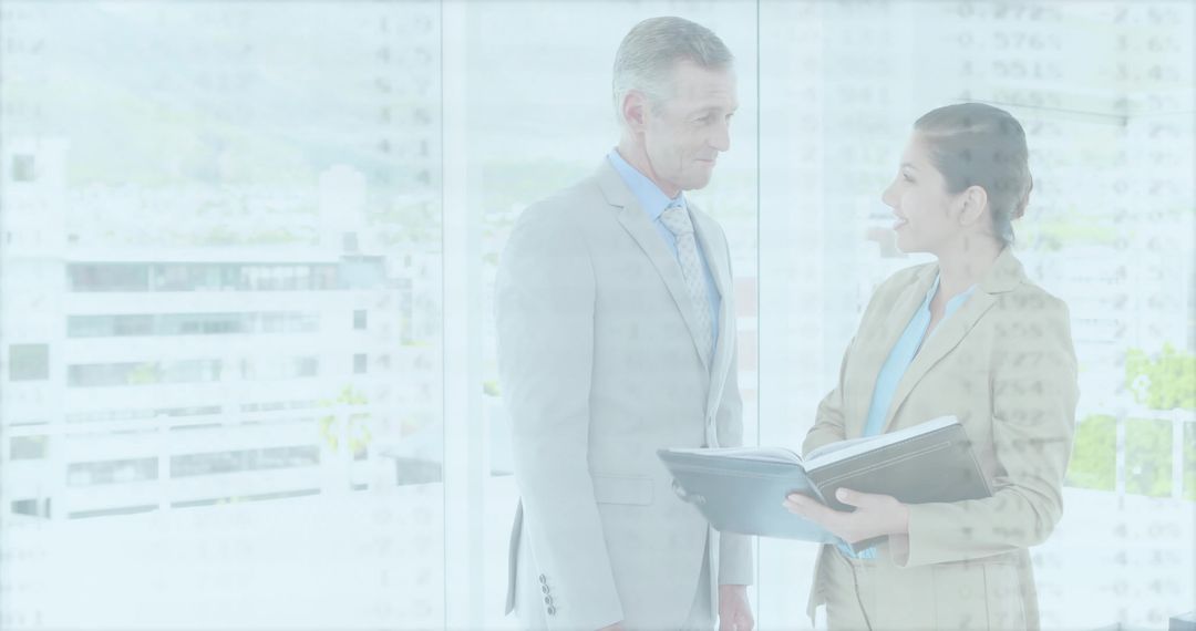 Professional Man and Woman Discussing Office Documents