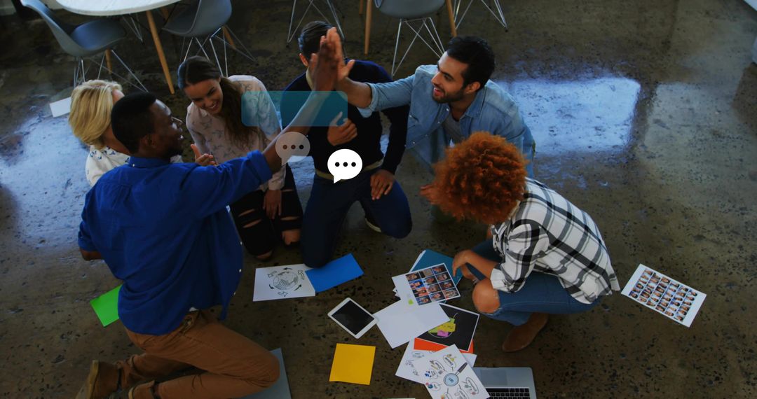 Dynamic Team Collaboration High-Fiving in Modern Office