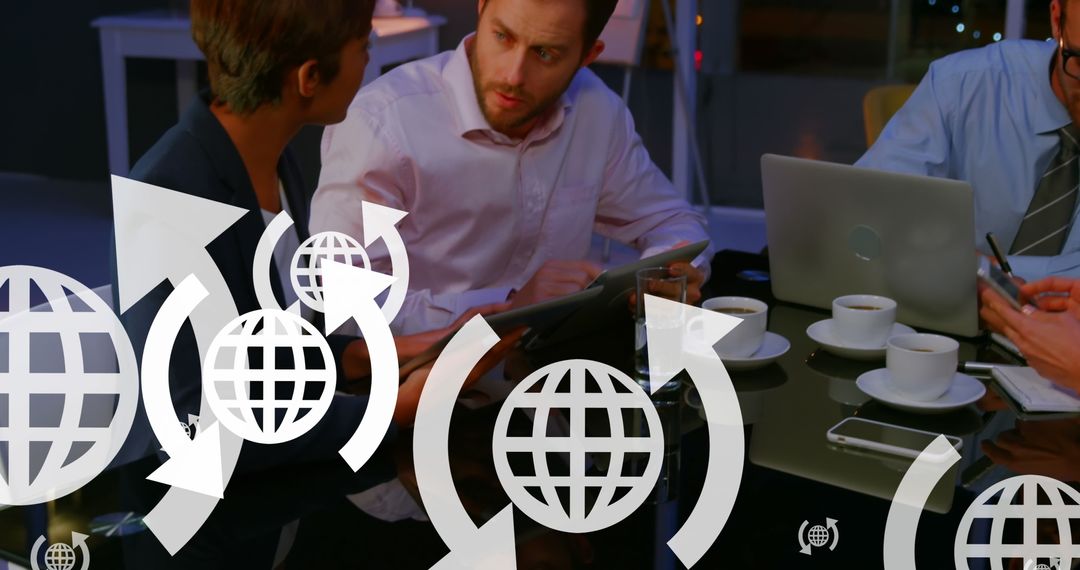 Diverse Coworkers Engaging in Strategic Business Discussion at Cafe