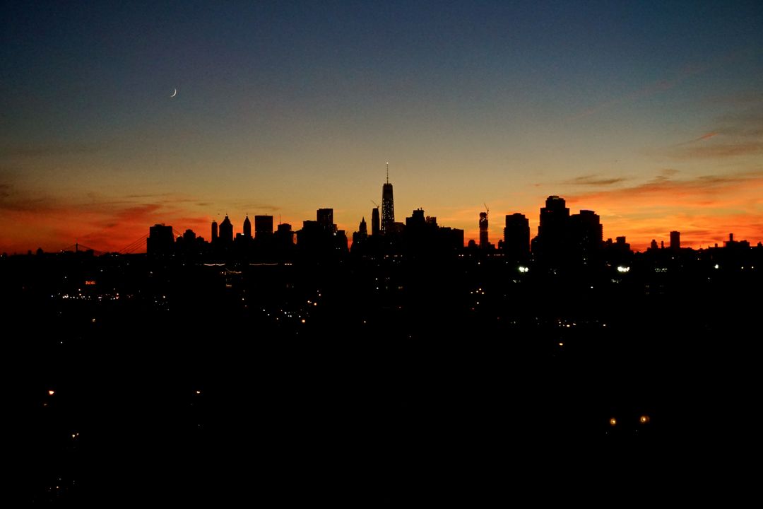 Urban City Skyline Silhouette at Sunset with Crescent Moon - Free Images, Stock Photos and Pictures on Pikwizard.com