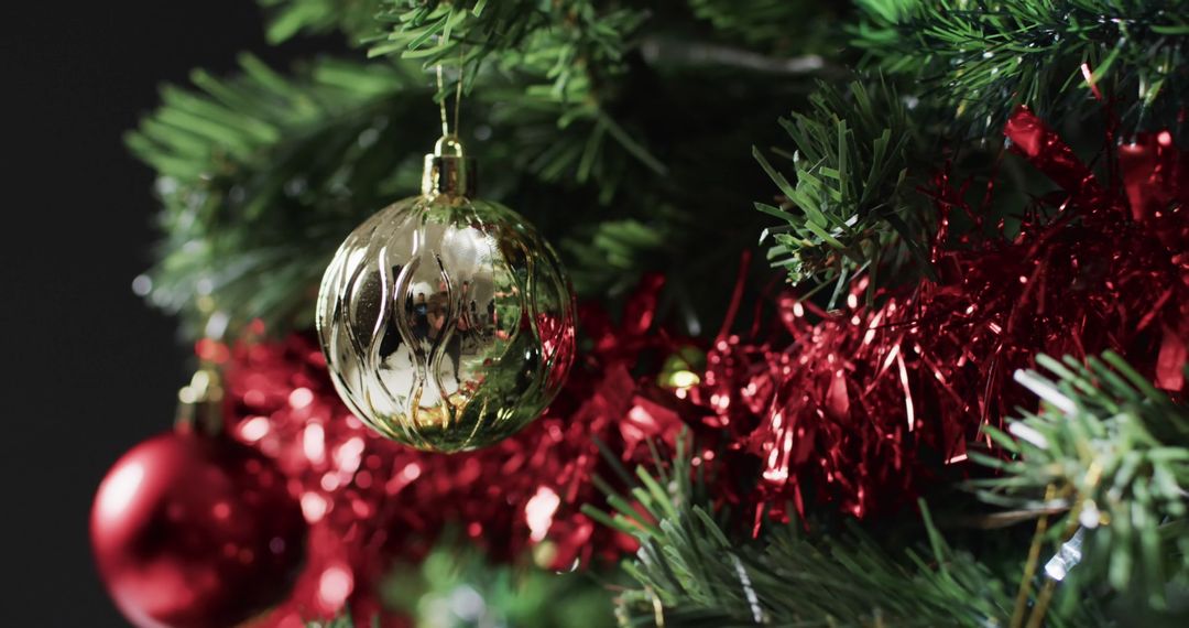 Close-Up of Festive Christmas Tree with Gold and Red Decorations