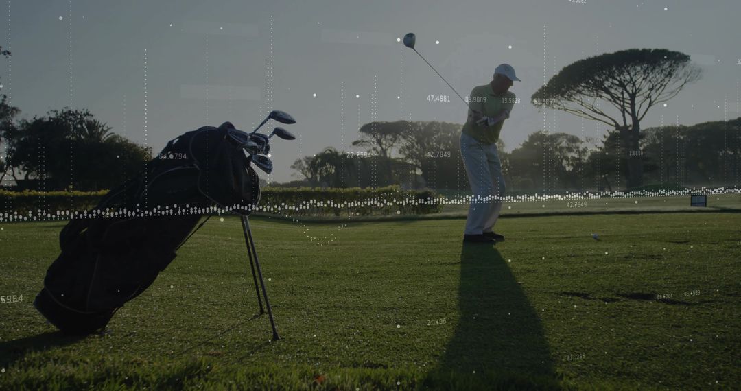 Senior Golfer Swinging with Data Overlay at Scenic Golf Course