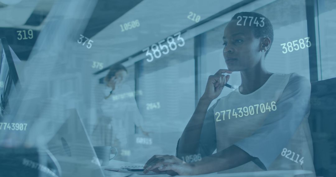 Businesswoman Analyzing Data on Computer Overlaid with Financial Numbers