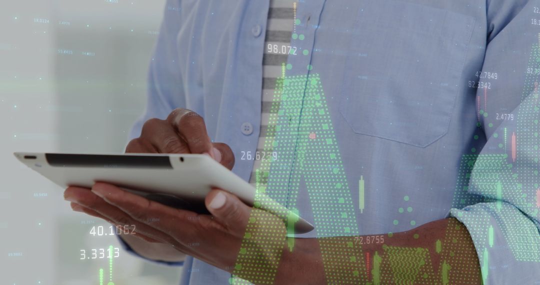 Businessman Analyzing Financial Data on Tablet With Virtual Charts