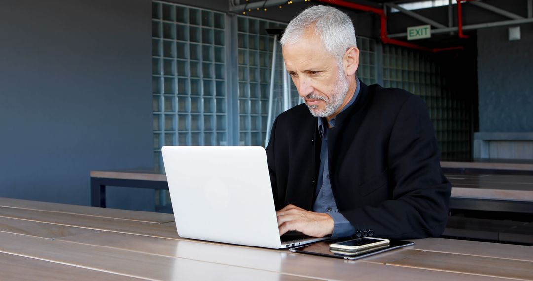 Mature businessman using laptop in hotel 4k - Free Images, Stock Photos and Pictures on Pikwizard.com