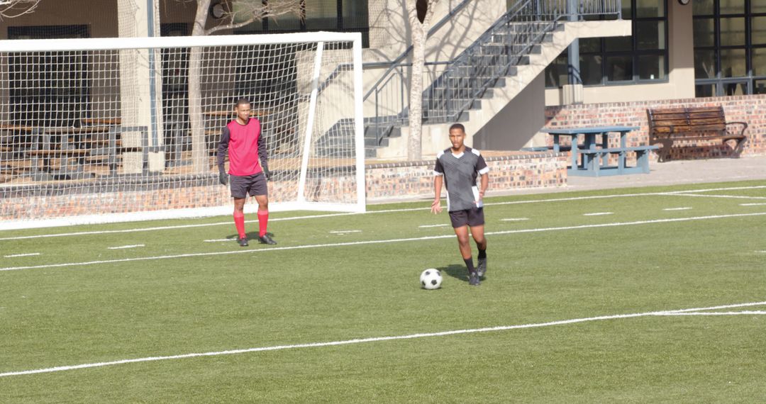 Soccer Players Enthusiastically Practicing on Outdoor Field for Team Development