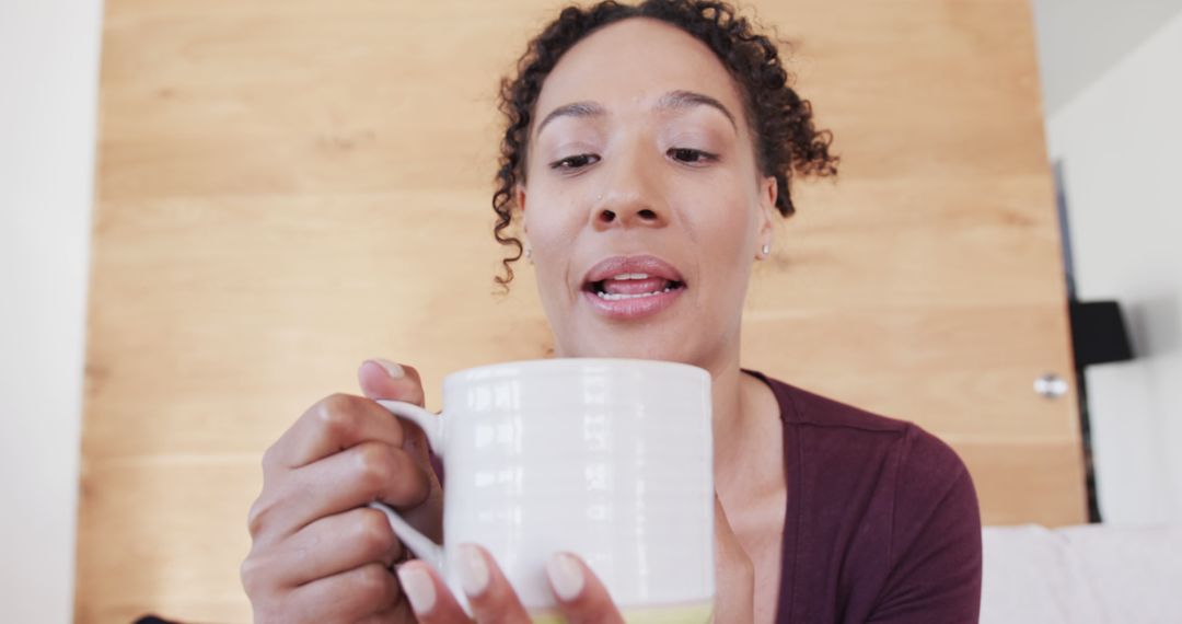 Woman Enjoying Hot Drink in Relaxing Home Environment - Free Images, Stock Photos and Pictures on Pikwizard.com