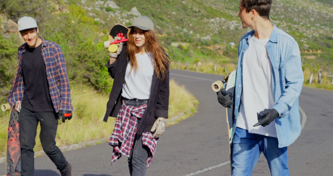 Group of Teenagers Walking on Road with Skateboards in Countryside - Free Images, Stock Photos and Pictures on Pikwizard.com