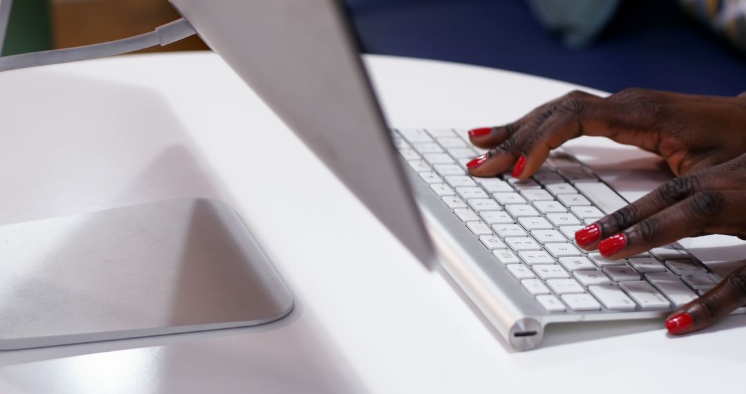 Woman's Hands Typing on Office Keyboard
