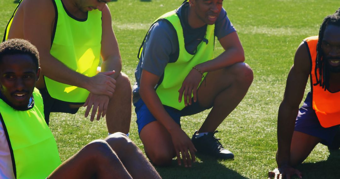 Diverse Group of Athletes Stretching on Sports Field - Free Images, Stock Photos and Pictures on Pikwizard.com