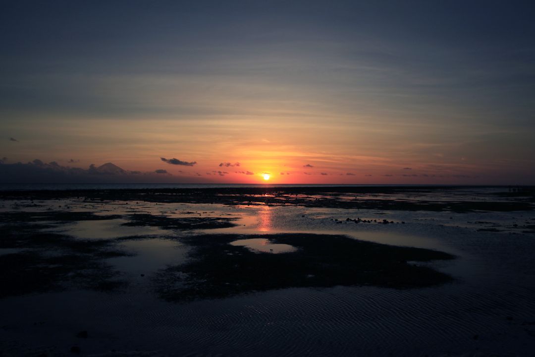 Serene Sunset Over Sandy Tidal Flats - Free Images, Stock Photos and Pictures on Pikwizard.com