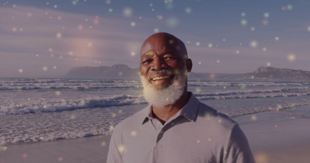 Senior Man Smiling at Beach Amidst Glowing Particles