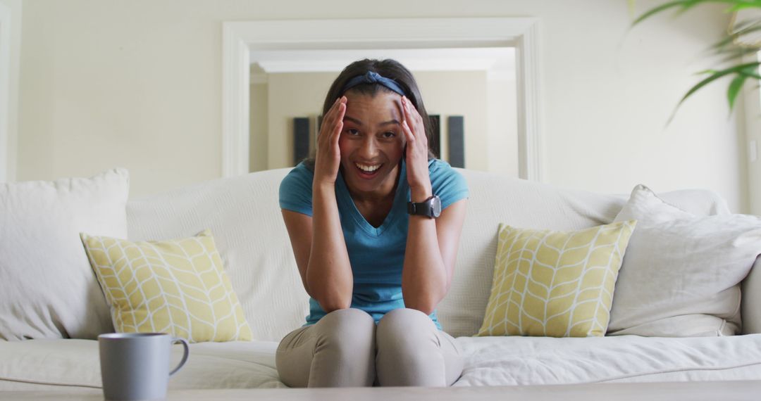 Excited Woman Having Video Call on Comfortable Home Couch