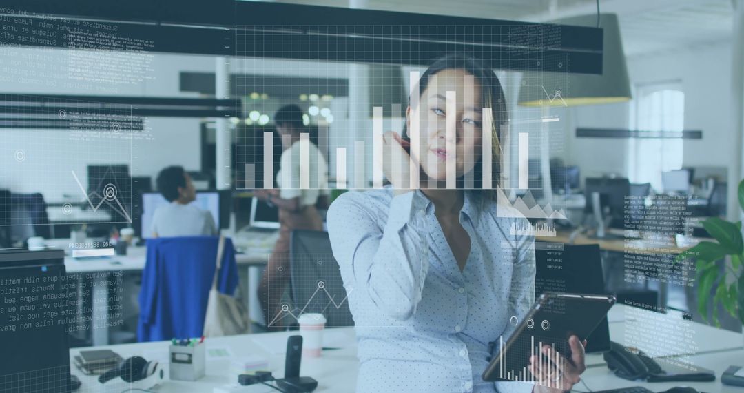 Businesswoman Analyzing Data with Digital Graphs in Modern Office