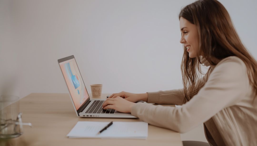Productive Woman Using Laptop in Minimalist Workspace
