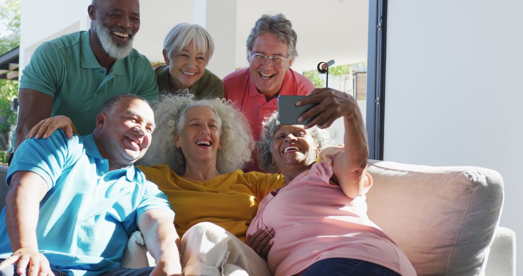 Group of Seniors Sitting on Couch and Taking a Selfie Together - Free Images, Stock Photos and Pictures on Pikwizard.com