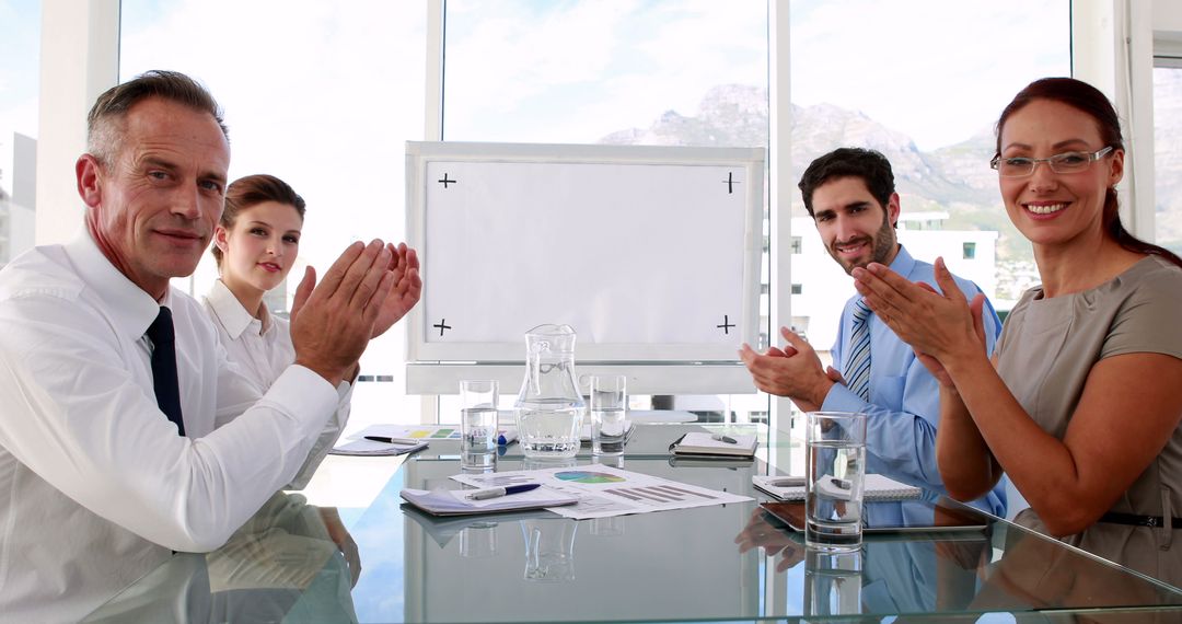 Business Team Applauding in Office Meeting Room - Free Images, Stock Photos and Pictures on Pikwizard.com