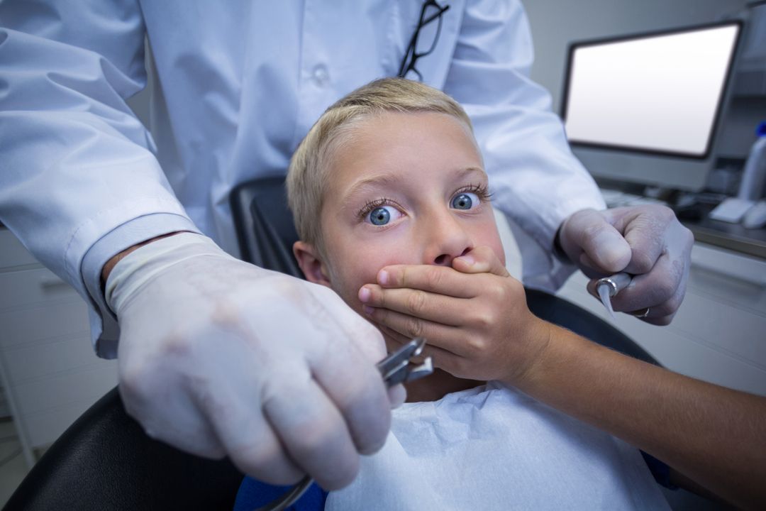 Young patient scared during a dental check-up - Free Images, Stock Photos and Pictures on Pikwizard.com