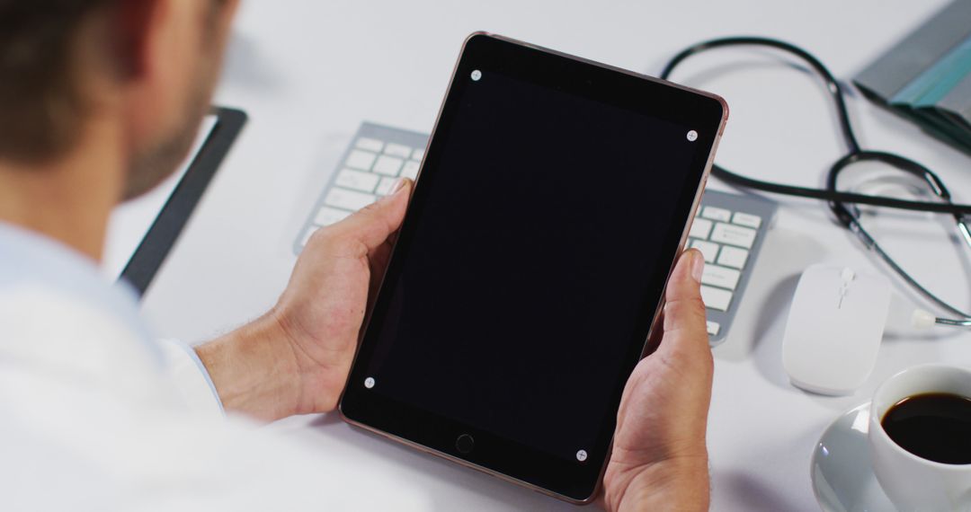 Doctor Holding Tablet in Modern Office Workspace - Free Images, Stock Photos and Pictures on Pikwizard.com