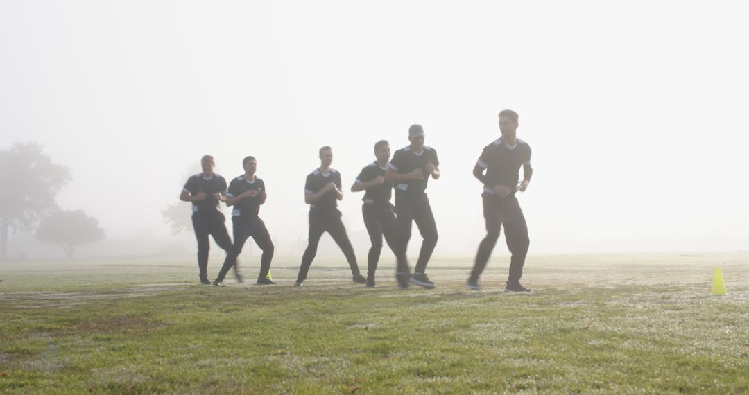 Team Running Drills in Foggy Park Enhancing Endurance and Teamwork