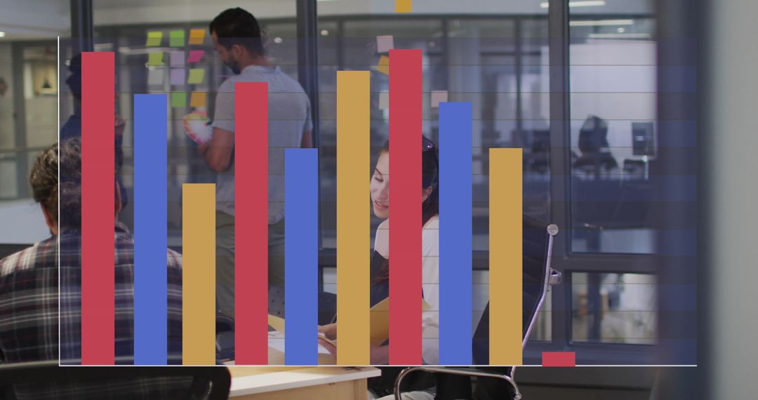 Diverse Team Analyzing Dynamic Bar Chart Data in Modern Office