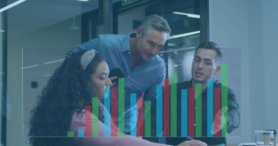 Diverse Team Analyzing Business Charts in Office Setting