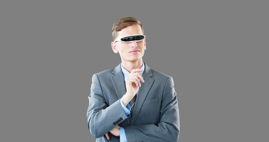 Businessman Wearing Futuristic Smart Glasses on Grey Background - Free Images, Stock Photos and Pictures on Pikwizard.com