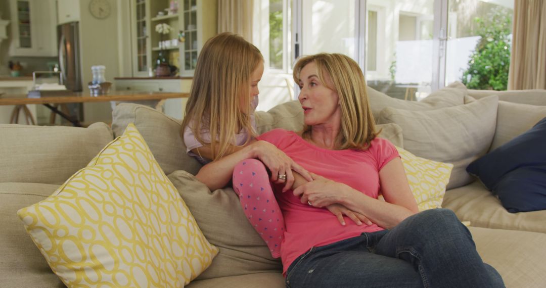 Mother and Daughter Having Conversation on Comfortable Sofa - Free Images, Stock Photos and Pictures on Pikwizard.com