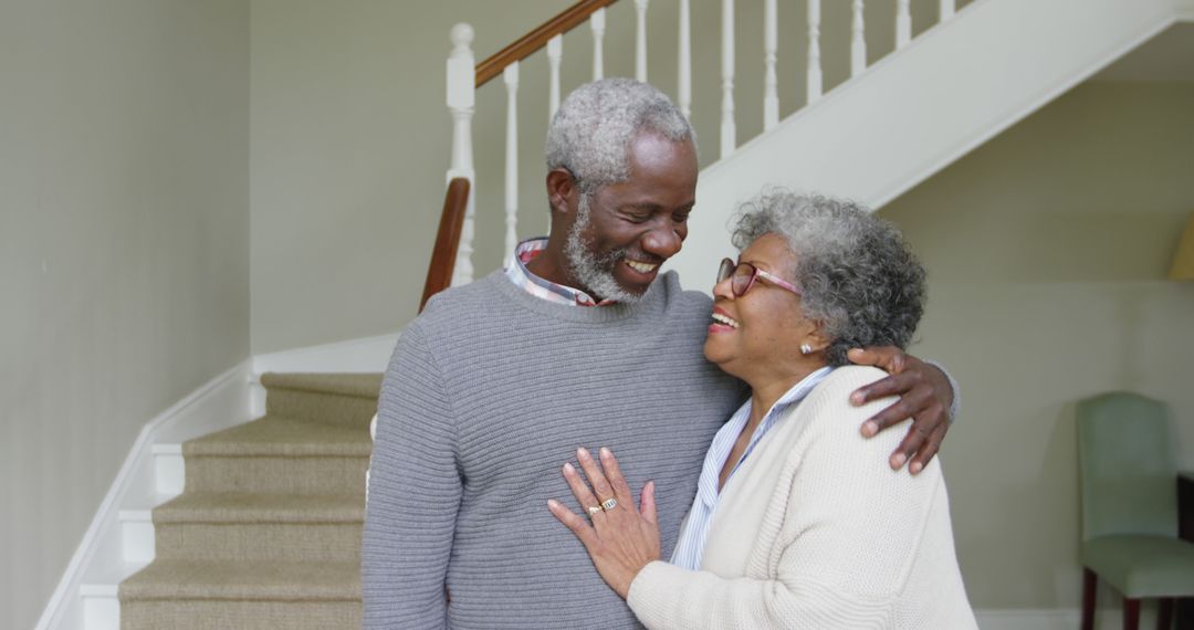 Happy Senior Couple Embracing at Home in Bright Setting