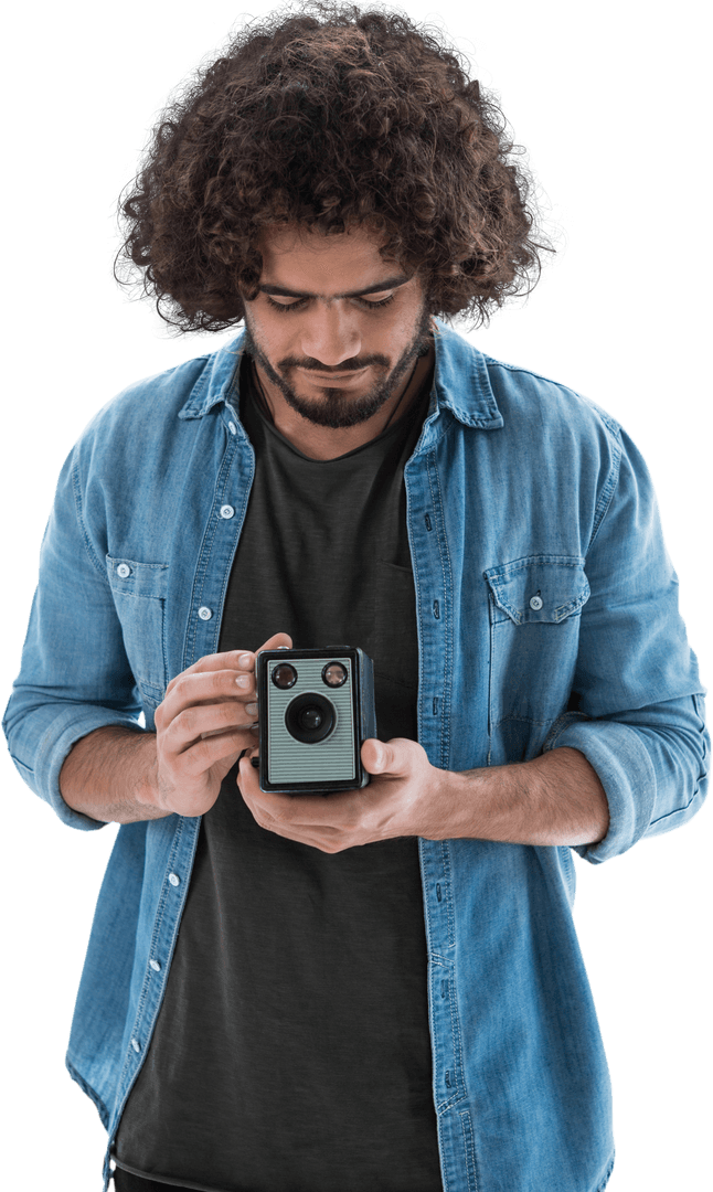 Man Holding and Inspecting Retro Transparent Camera