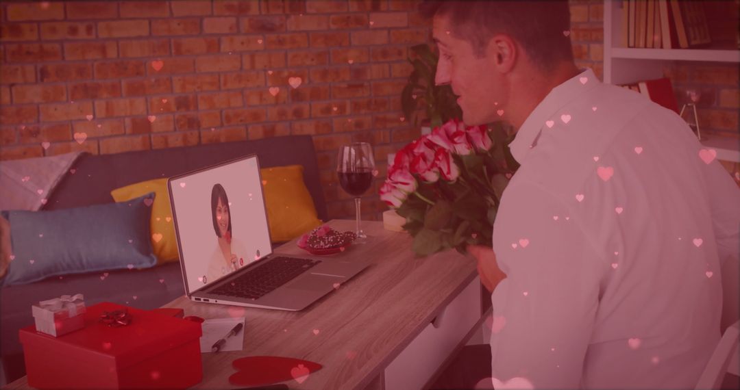 Caucasian Man Video Calling on Valentine's Day with Hearts Overlay