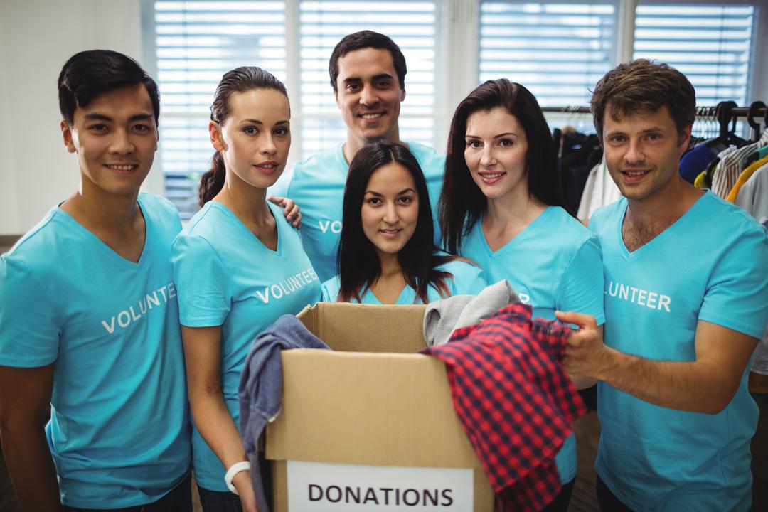 Group of volunteers with donation box - Free Images, Stock Photos and Pictures on Pikwizard.com