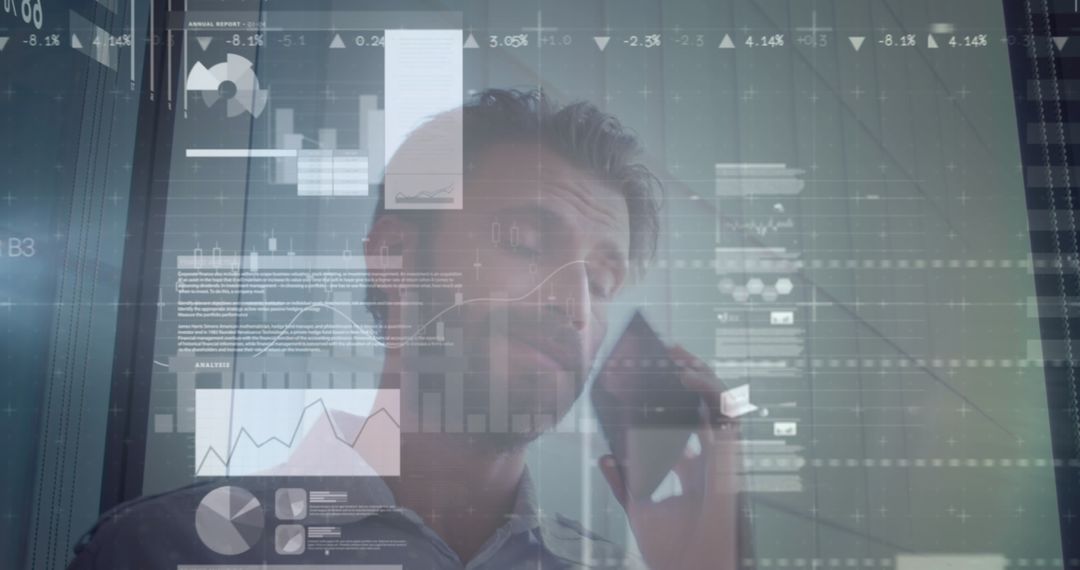 Businessman Analyzing Data with Financial Graphics Overlay