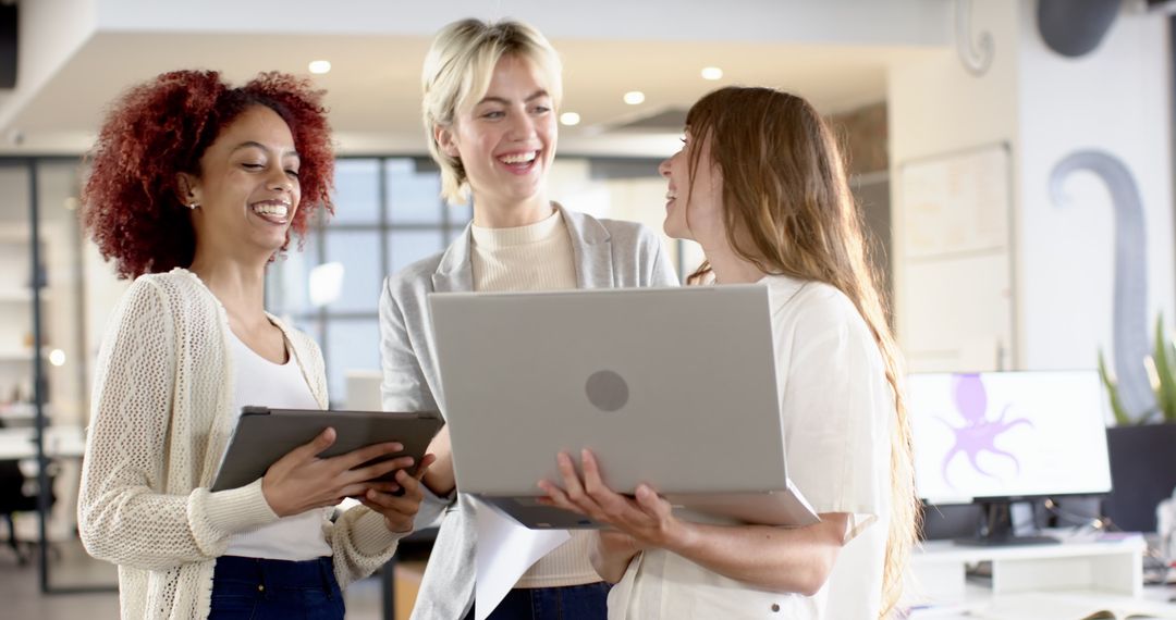 Female Team Collaborating on Business Project in Modern Office Environment