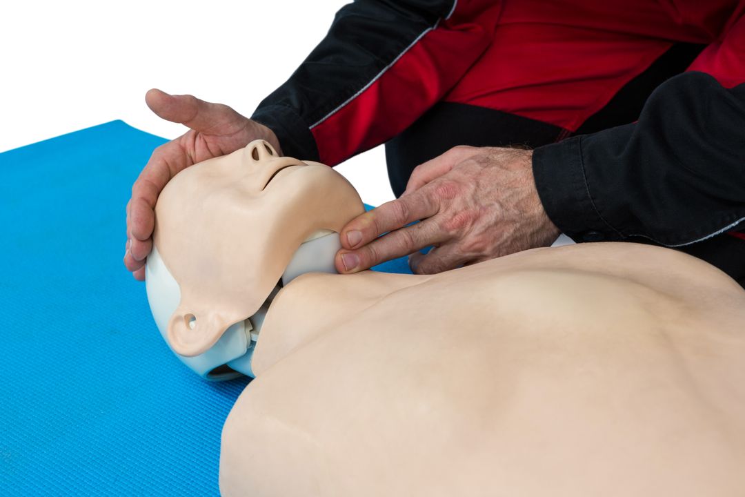 Paramedic practicing resuscitation on dummy - Free Images, Stock Photos and Pictures on Pikwizard.com