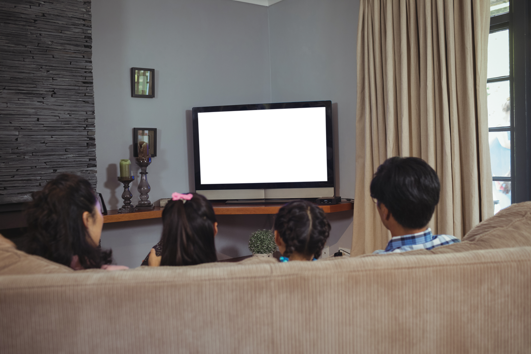 Family Watching Television with Transparent Screen, Rear View at Home - Download Free Stock Images Pikwizard.com