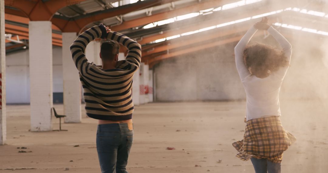 Couple Dancing in Dusty Warehouse - Free Images, Stock Photos and Pictures on Pikwizard.com