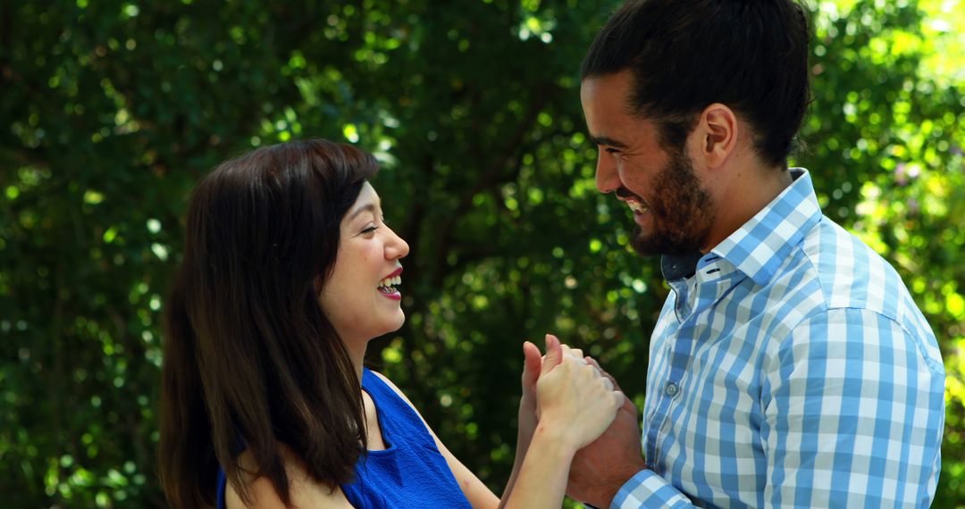 Happy Multicultural Couple Enjoying Outdoor Conversation