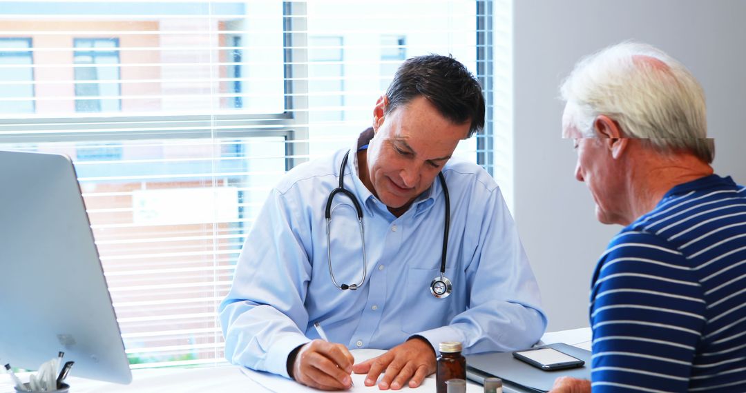 Doctor Having Conversation with Senior Patient During Medical Consultation - Free Images, Stock Photos and Pictures on Pikwizard.com