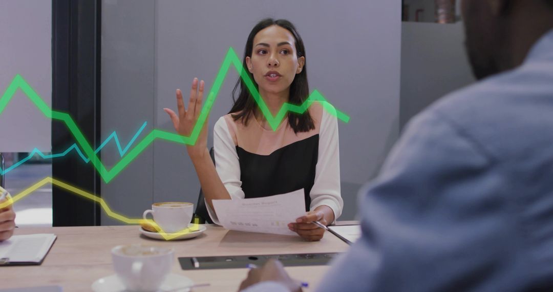 Businesswoman Leading Meeting on Analytics with Chart Overlay