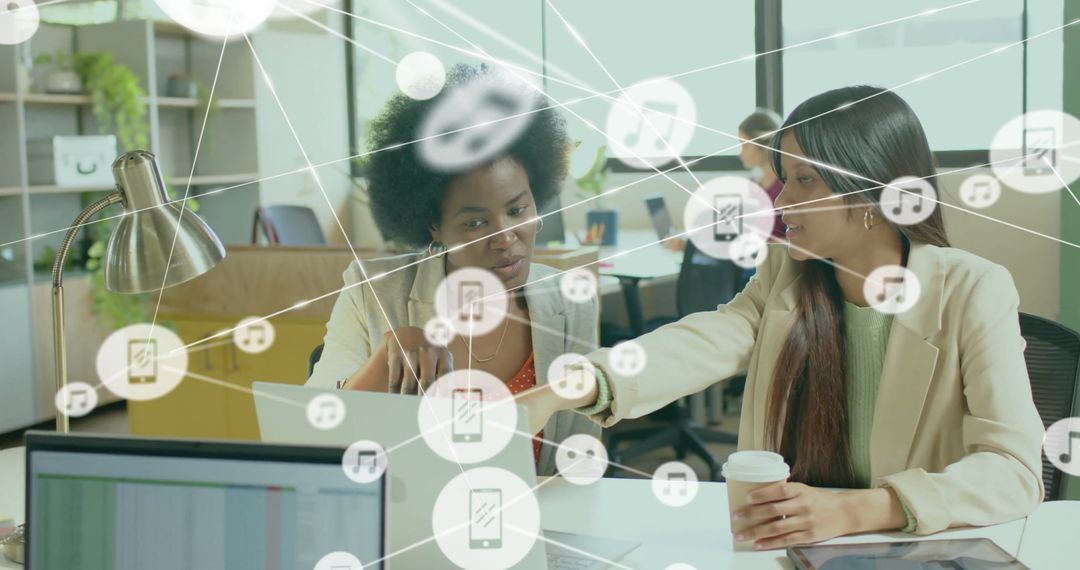 Diverse Female Colleagues Collaborating with Digital Interface Connections