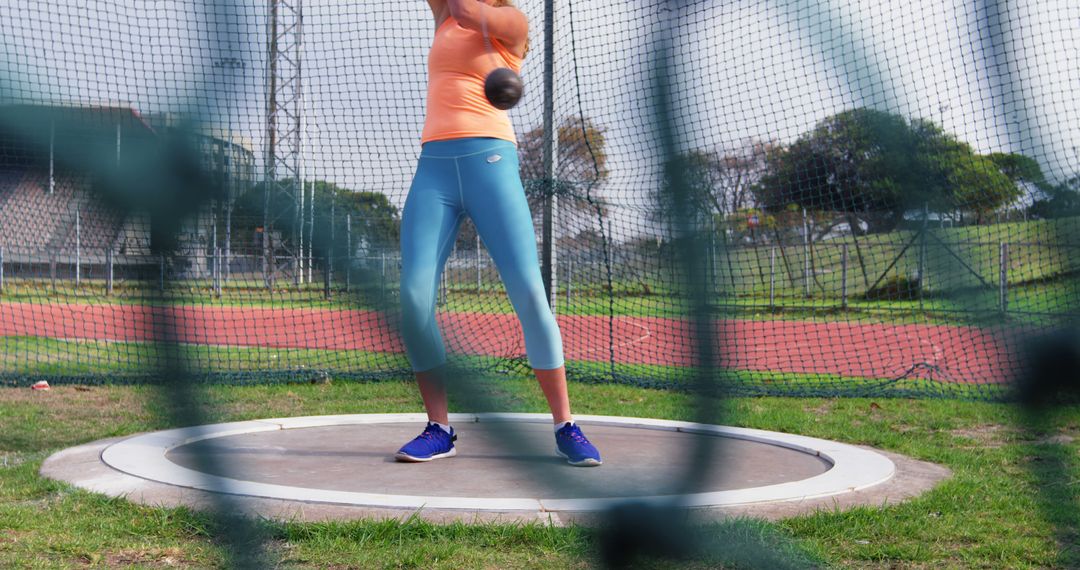 Female Athlete Practicing Hammer Throw in Sports Ground - Free Images, Stock Photos and Pictures on Pikwizard.com