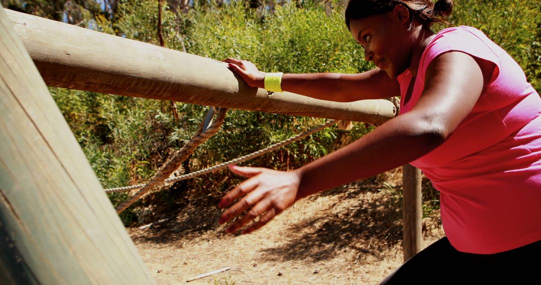 Black Woman Overcoming Obstacle Course in Woods - Free Images, Stock Photos and Pictures on Pikwizard.com