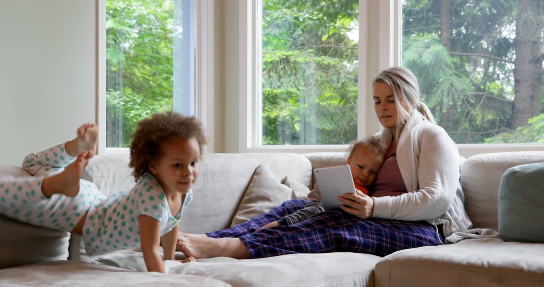 Mother Relaxing with Children in Cozy Living Room - Free Images, Stock Photos and Pictures on Pikwizard.com