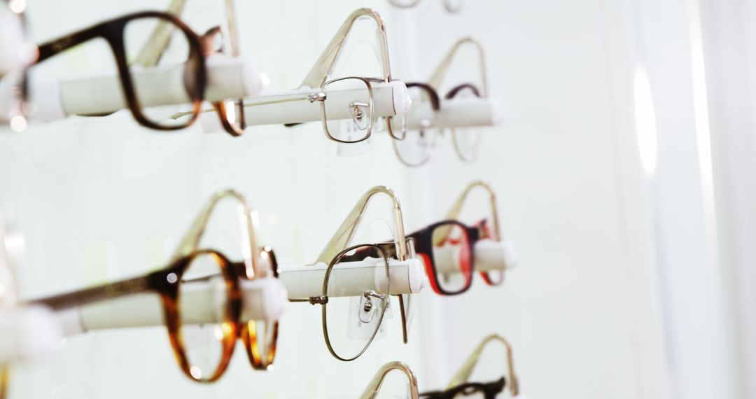 Variety of Prescription Eyeglasses on Display Rack in Optician Store - Free Images, Stock Photos and Pictures on Pikwizard.com