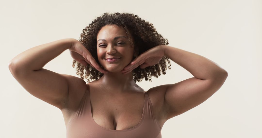 Confident Plus Size Woman Smiling in Studio