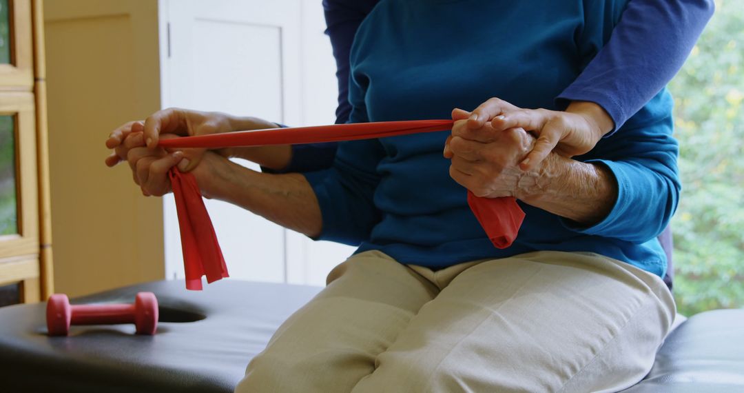 Senior Woman Practicing Physical Therapy with Stretch Band - Free Images, Stock Photos and Pictures on Pikwizard.com