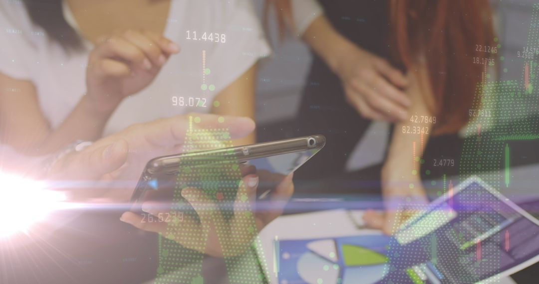 Team Analyzing Data on Smartphone and Tablet with Digital Graphs